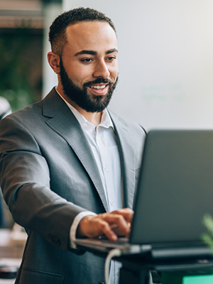 man looking at his computer