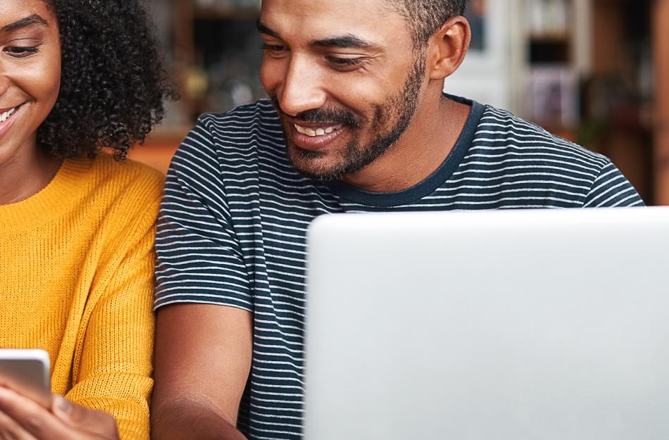 man and woman looking at their phone